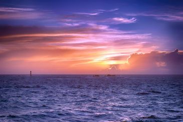 AC 105 - Lighthouse at sunset, Guernsey - stunnig sunset - art prints 